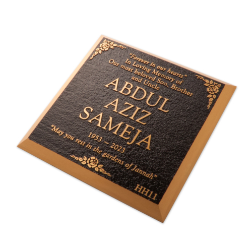 Cast bronze memorial plaque for setting in to grass with bevelled edges.