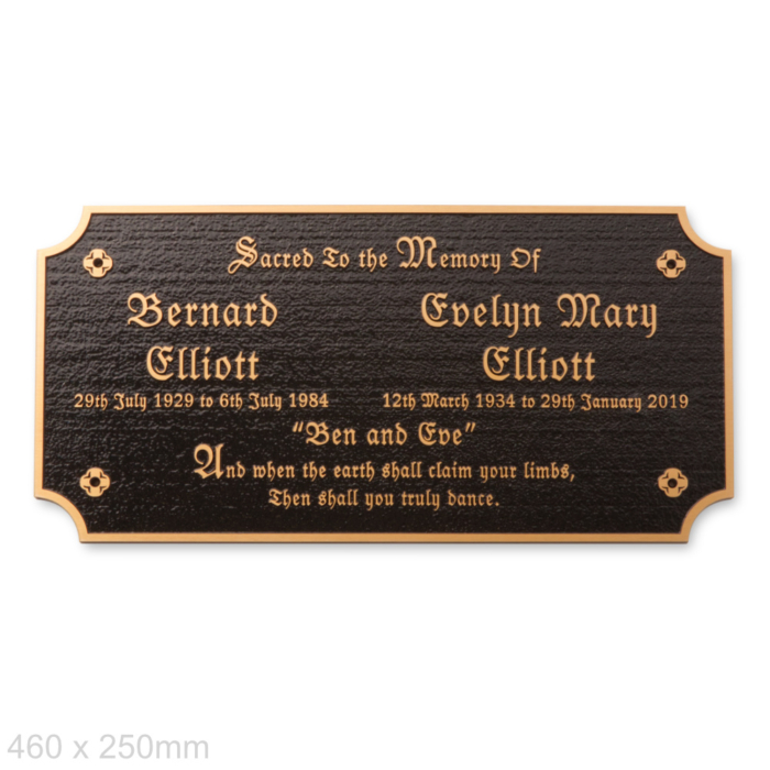 Big cast bronze memorial plaque with black background and gothic font with motifs