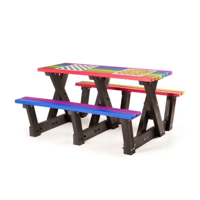 Multi coloured step through picnic table with integral games fitted.